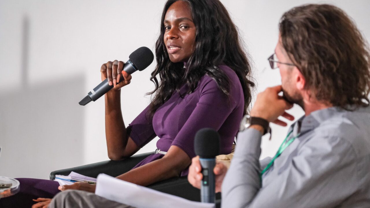 Speaker Grace Awino Head of Protection, Gender and AAP Unit of WFP South Sudan and Chair Haakon Spriewald LNOB Project Coordinator at the panel.