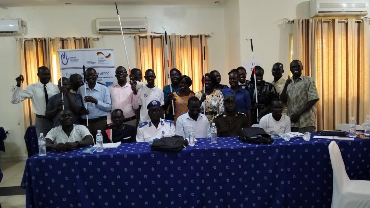 Group of persons, having white canes in their hands, pose for the camera during stakeholder’s roundtable discussion workshop in Juba, South Sudan.
