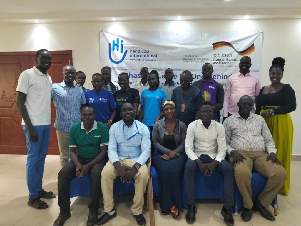 Participants posing to camere during Phase 3 project closure workshop in Juba South Sudan.