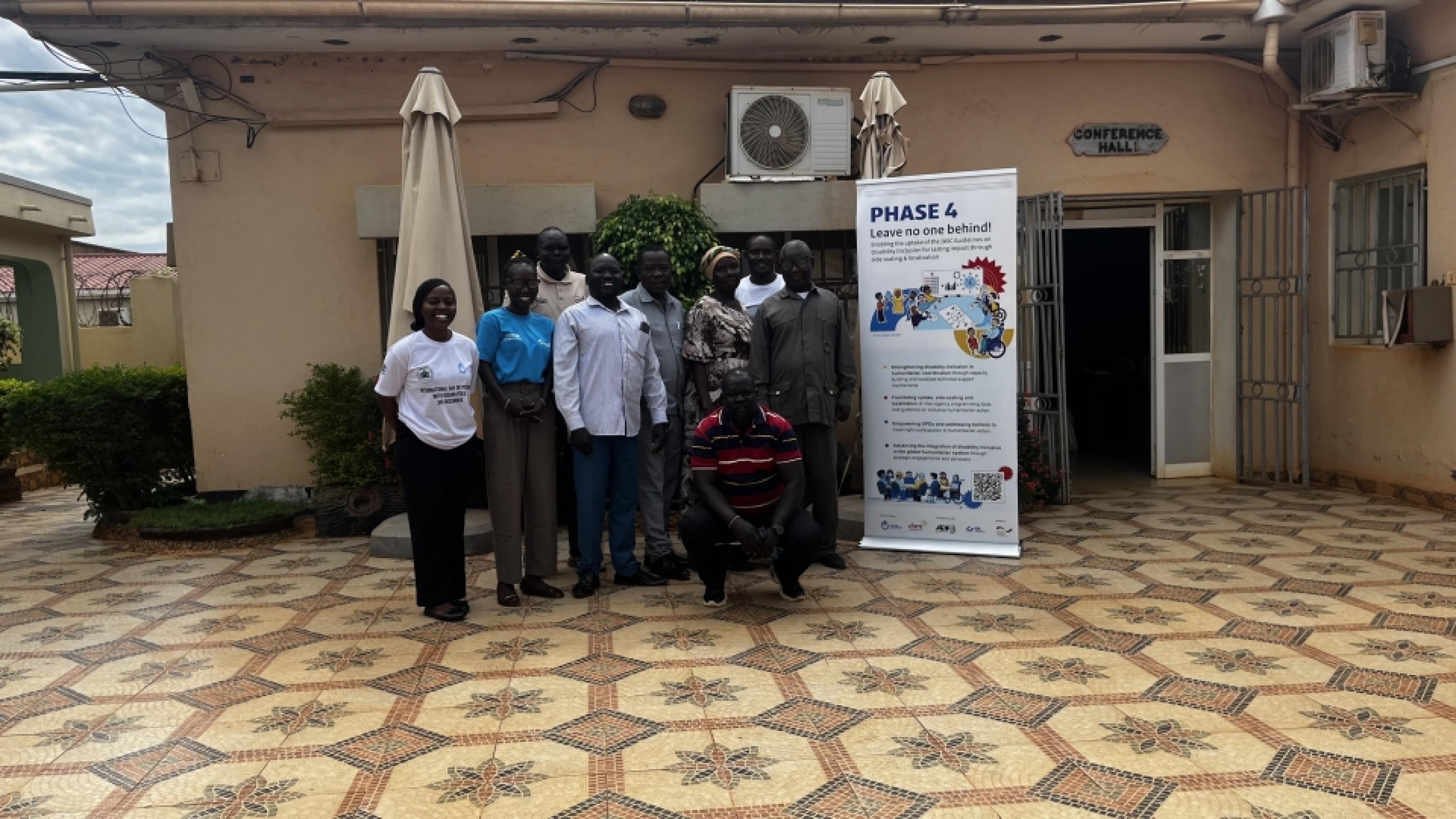 Participants pose for a group photo during the roll-out of IWASH at Universal Hotel-Wau, South Sudan © Deng / Universal gap, Wau, South Sudan.