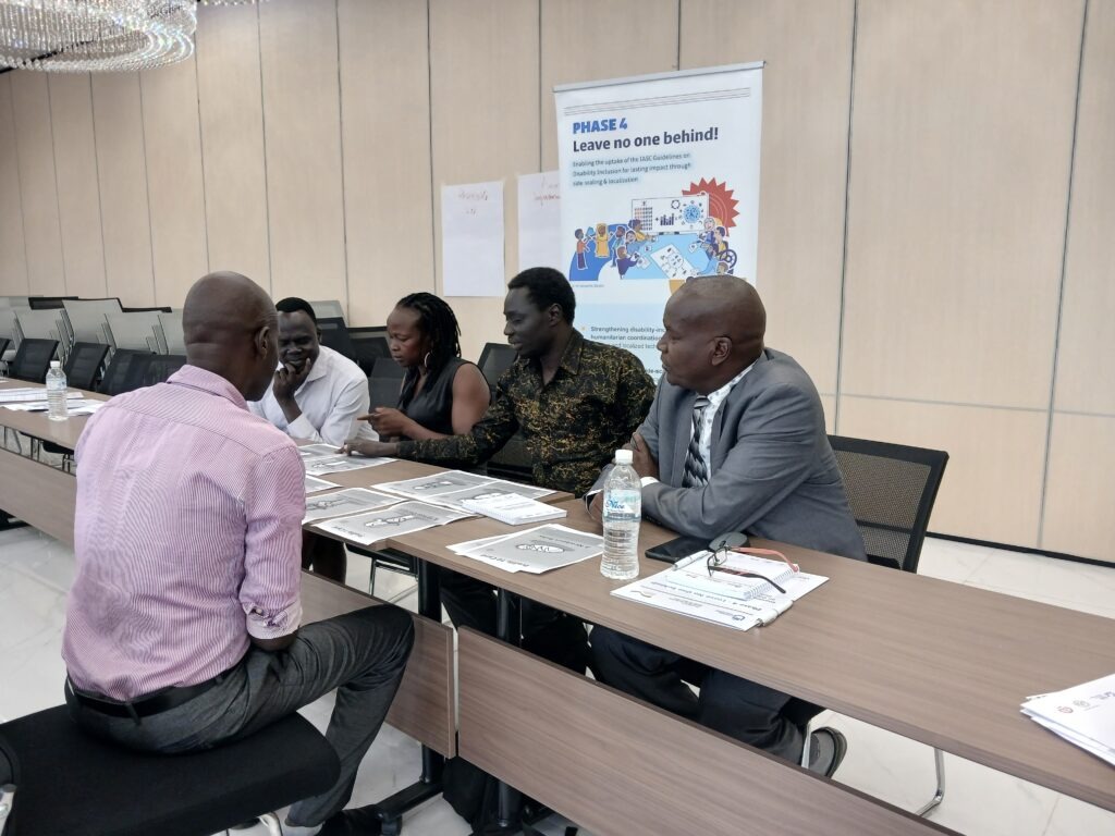 Participants engaged in group work on intersectionality using vulnerability cards during the inclusive Food Security Training to FSL partners at the Glory Regency hotel 18th August 2026, Juba