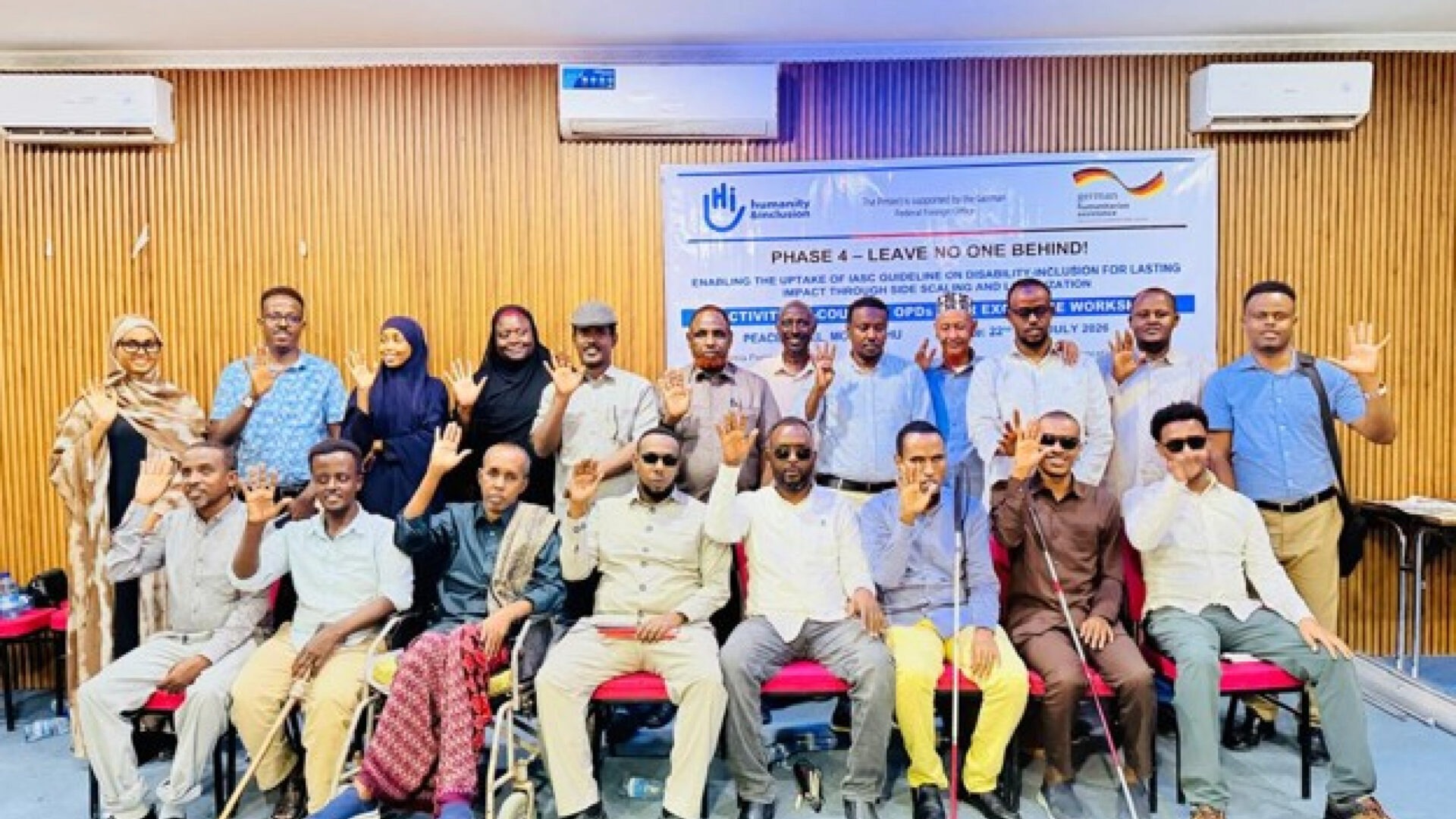 Photo 1: participants and facilitators posing for a group photo during OPD Peer Exchange Workshop, Peace Hotel, Mogadishu, Somalia