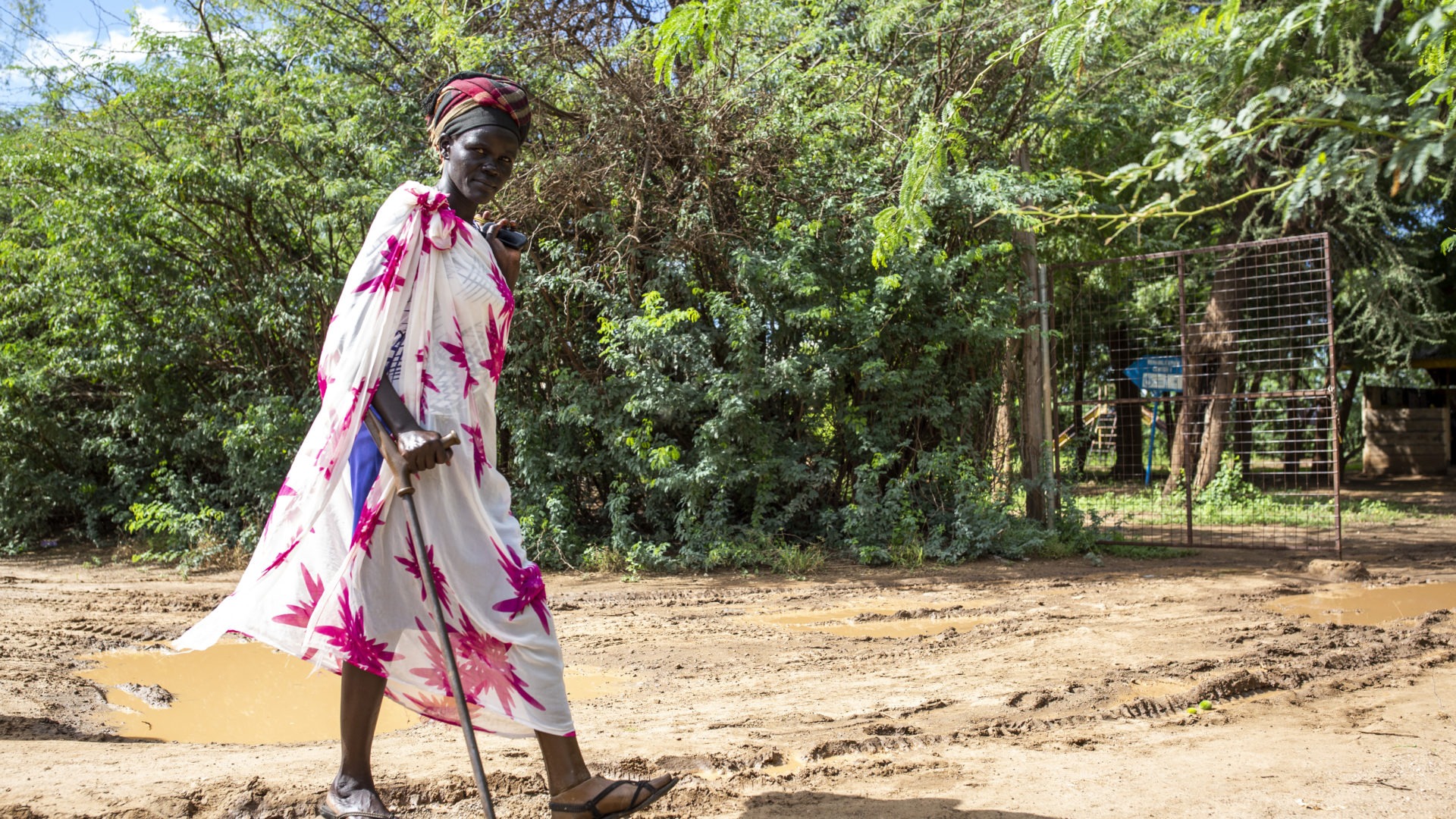 Women with disability using a crutch