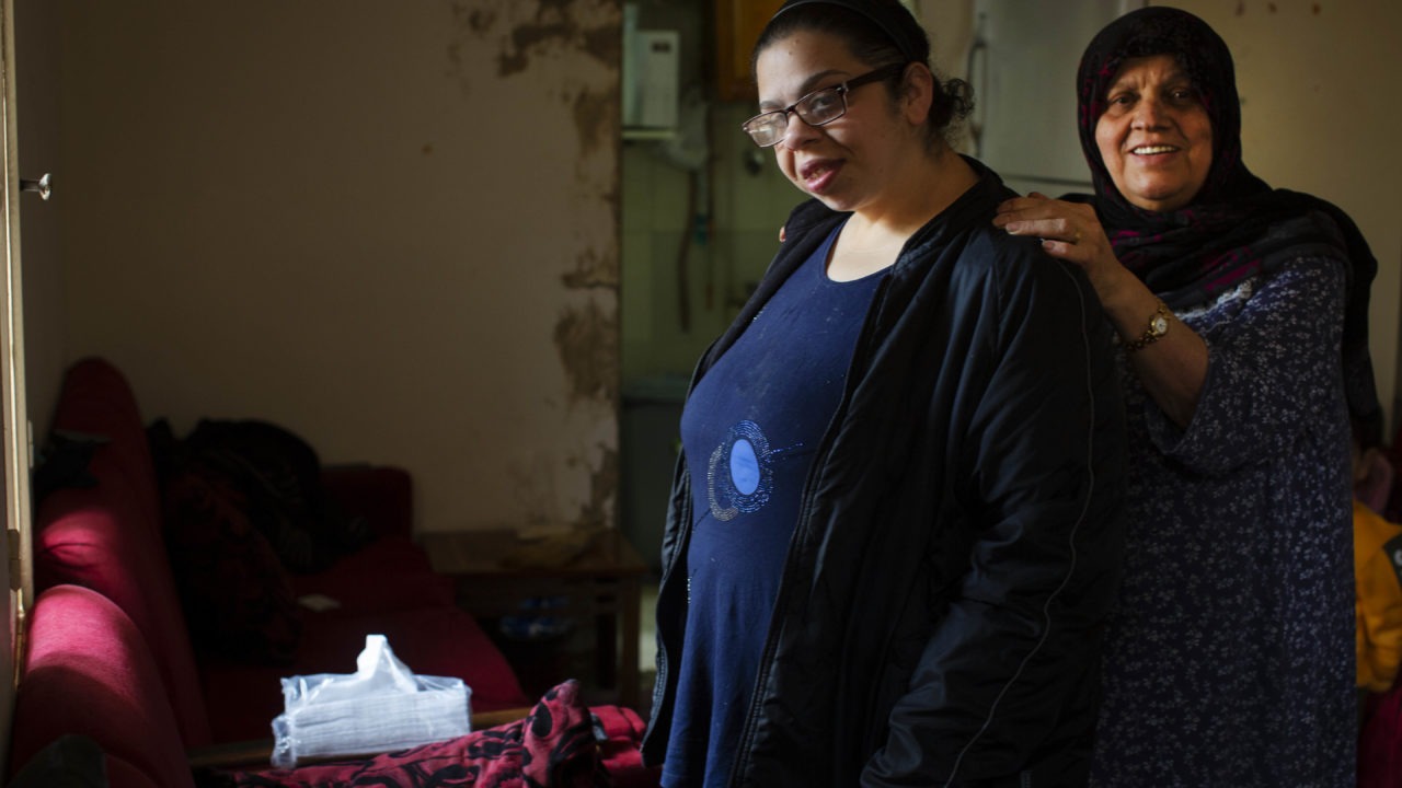 This picture shows a younger and an older woman in their flat.