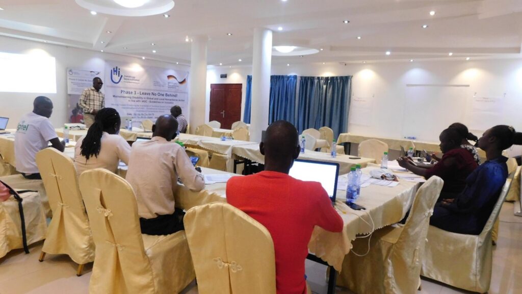 OPD co-facilitator presenting session and participants listening during the training at Juba