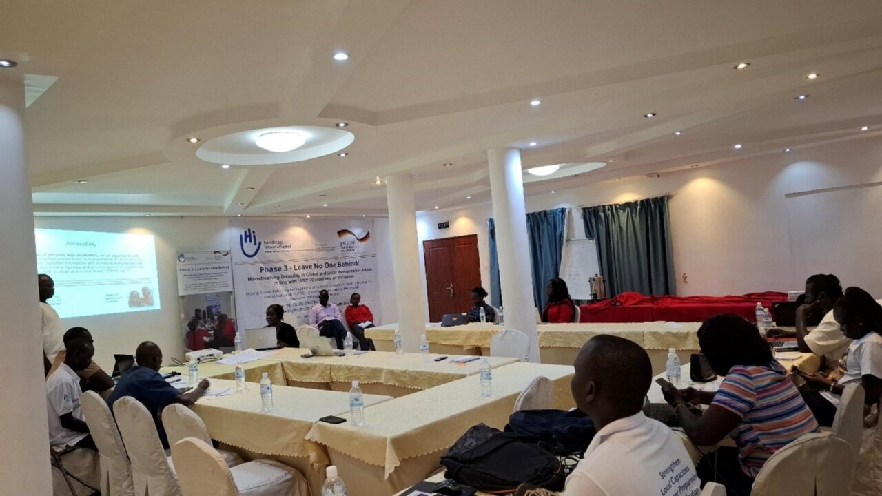Training participants sitting in the workshop room and listening presentation.