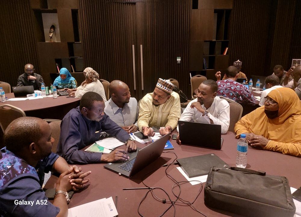 A group of participants engaged in a discussion during the training.
