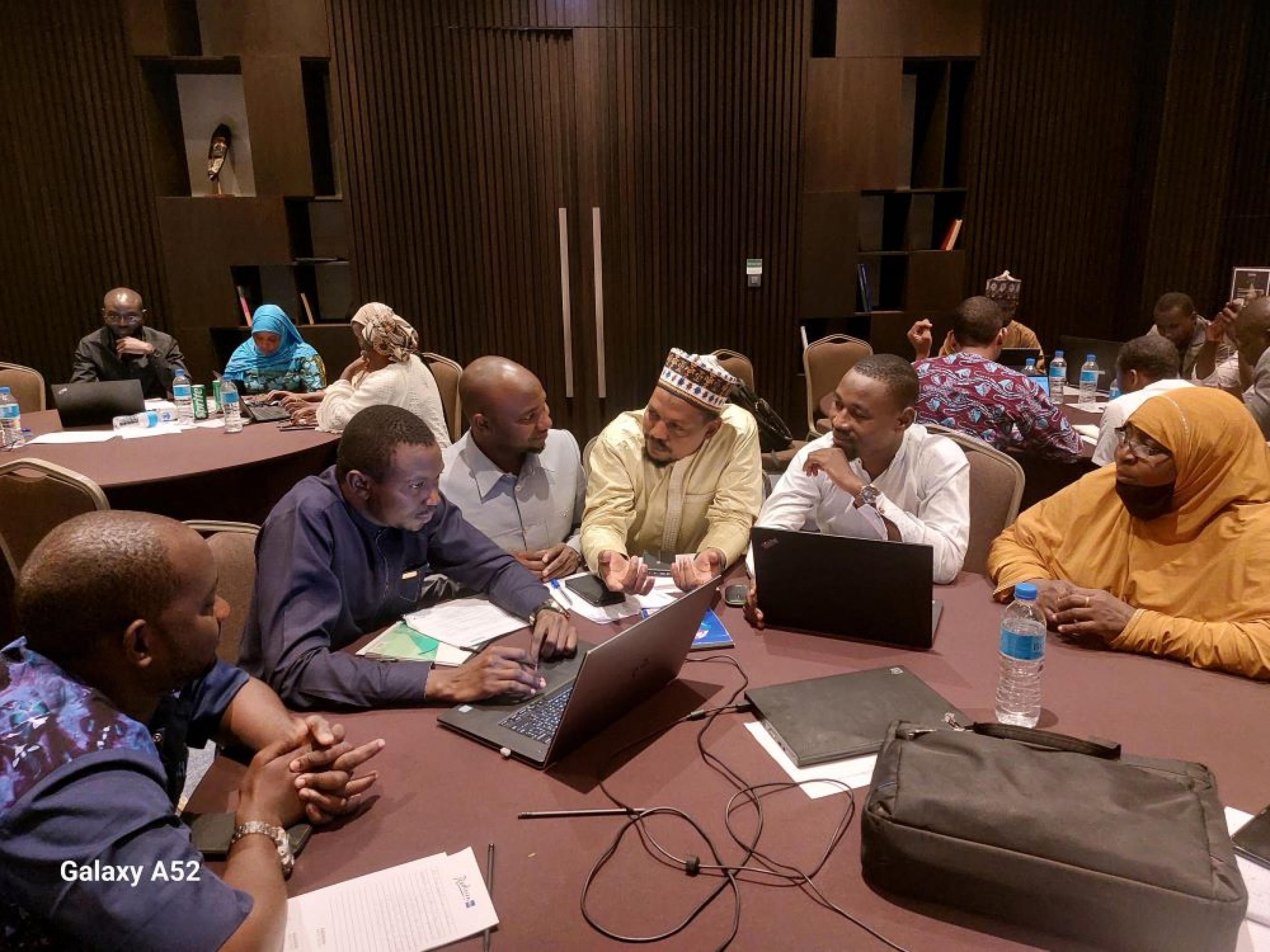 A group of participants engaged in a discussion during the training.