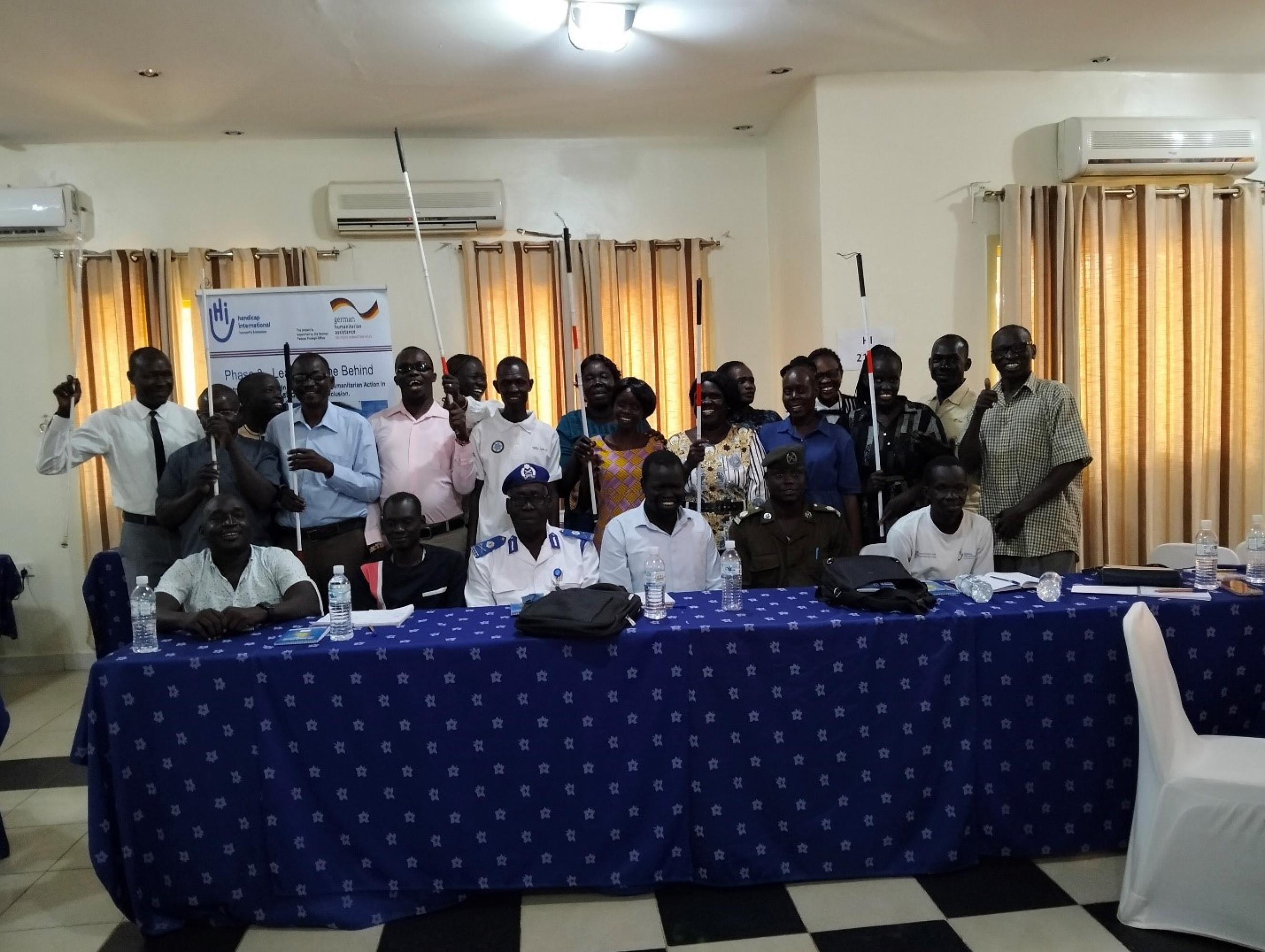 Group of persons, having white canes in their hands, pose for the camera during stakeholder’s roundtable discussion workshop in Juba, South Sudan.