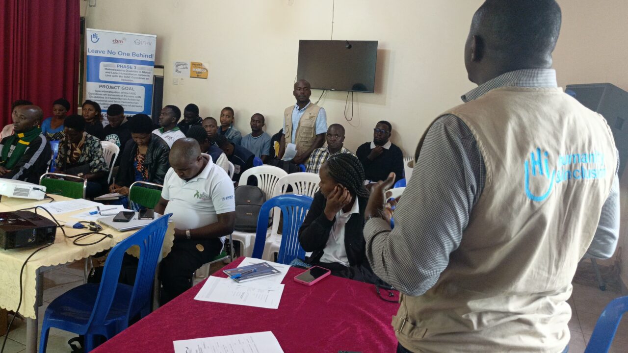 Man speaking in front of the workshop participants.