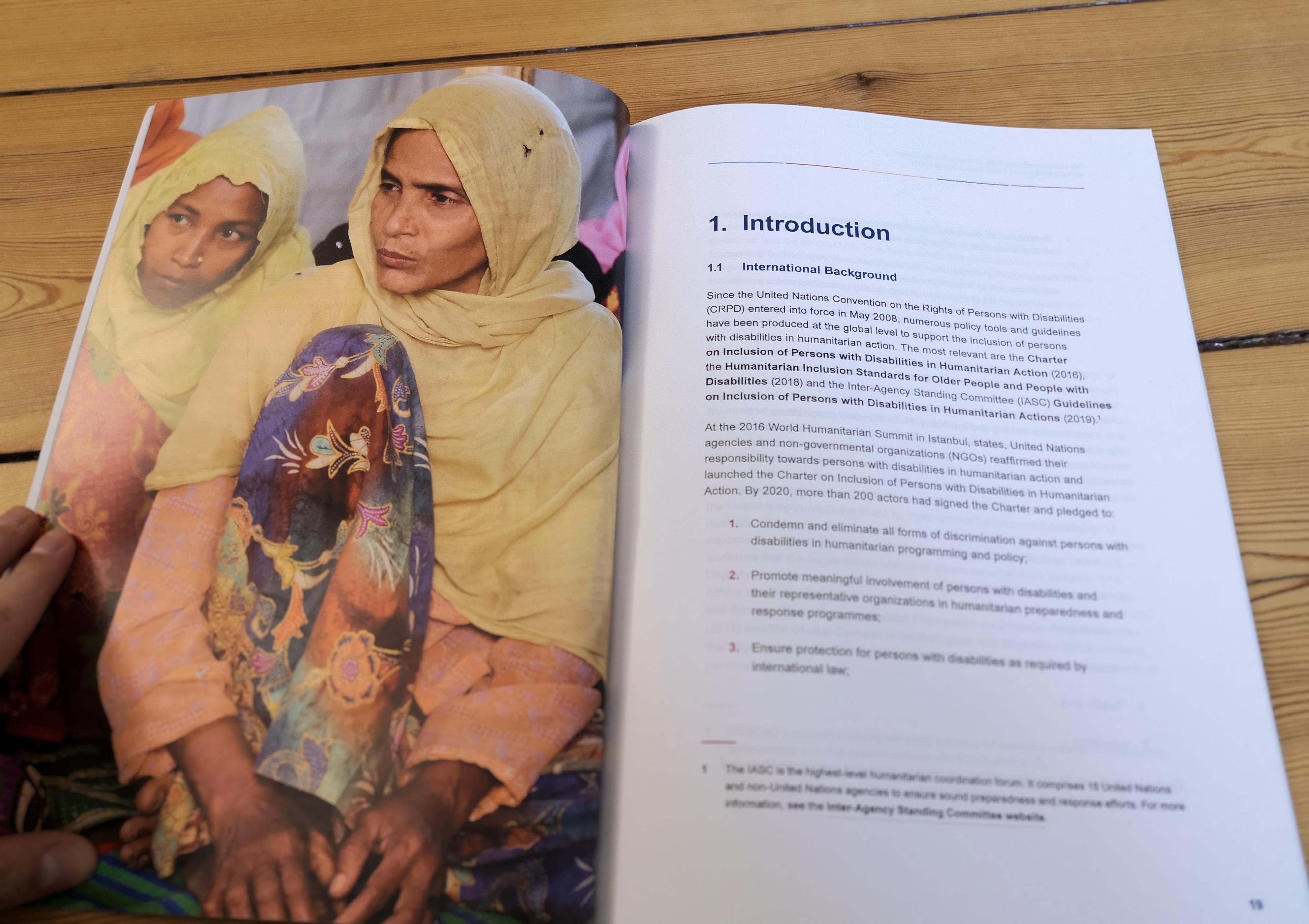 The photo shows the introductory chapter of the research report on inclusive humanitarian action in Bangladesh.